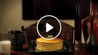 Cat eating pancakes