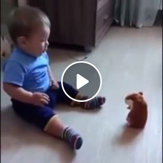 Baby scared of Talking Hamster toy