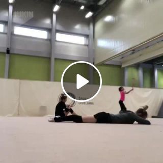 Rhythmic gymnast gets hit in the face with soccer ball