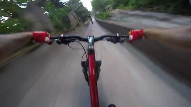 Bikers speed through abandoned bobsled track, sports.