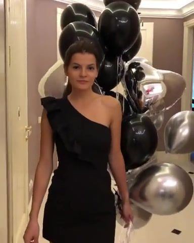 Beauty taking some balloons for a stroll
