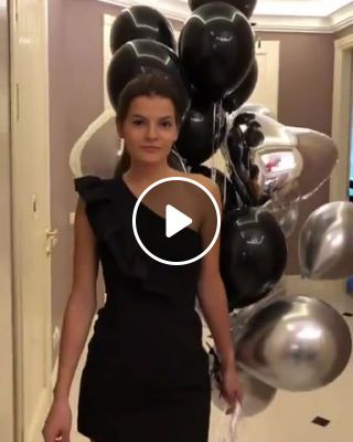 Beauty taking some balloons for a stroll