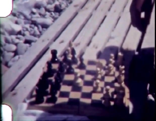 Two people play chess, sea, 8mm film, 8mm, archive live, archive, chess, footage of my grandfather, family history, 8mm digitization, nature travel.