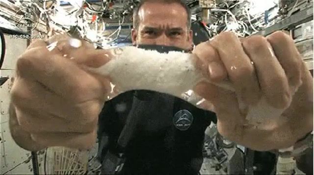 Squeezing towel in space, science technology.