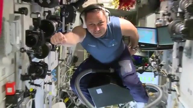 Russian Astronaut Flying On A Vacuum Cleaner In ISS. Science Technology.