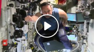 Russian astronaut flying on a vacuum cleaner in iss