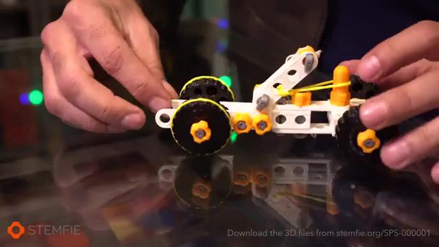 The stemfie 3d printable rubber band driven toy car, 3d printing, 3dprintables, stemfie3dproject, playset, construction set, lego, meccano, rubber band, car, toy, toys, 3dprinter, 3dprinting, stemfie3d, stemfie, science technology.