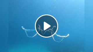 Two air rings meet underwater