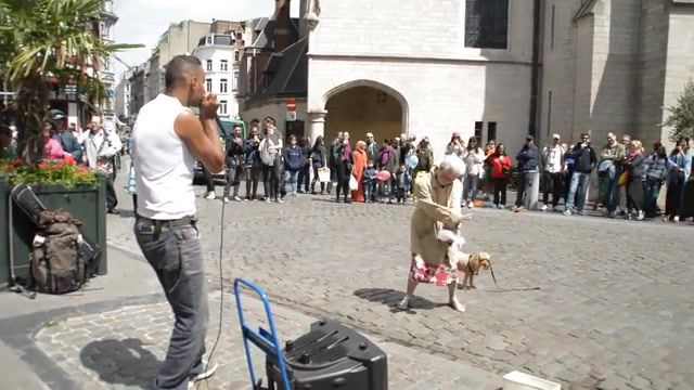 Old lady dancing to a beatboxer on the street