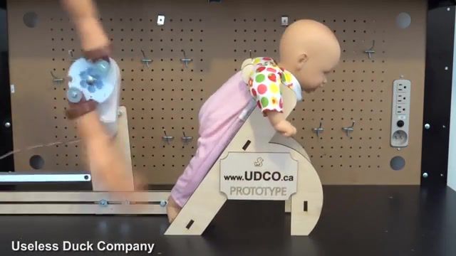 Baby burping robot, hands, burping, prototype, invention, robot, baby burp, how to burp a baby, science technology.