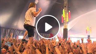 Singer catches beer while crowdwalking, and drinks it