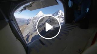 2 wingsuit flyers BASE jump into a plane in mid air. A Door In The Sky