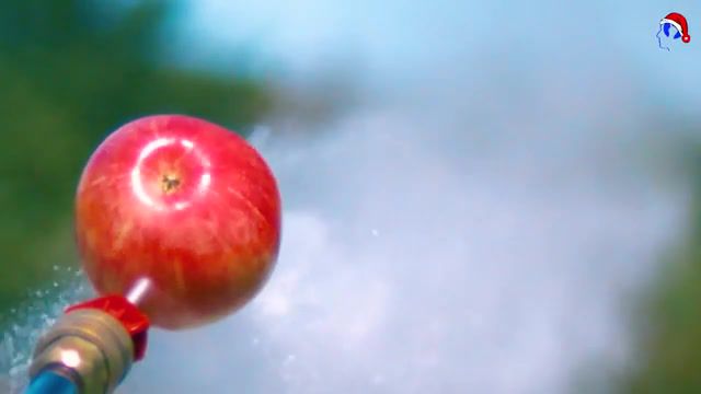 Water cuts apple, slow motion, slowmo, apple, science technology.