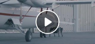 Walking robot pulls a plane