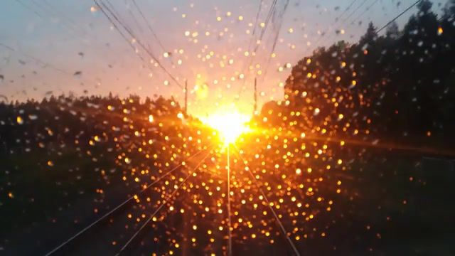 A few words in title, sunset, raindrops, train, nature travel. #2