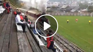 Train goes through the football stadium