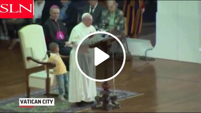 Pope and little boy, the pope, pope francis, boy on stage with pope, boy wanders on stage with pope. #0