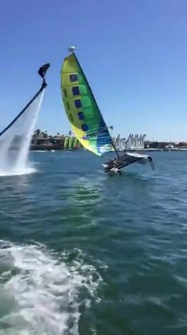 Jetboarder rescues flipped over catamaran, Nature Travel