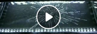 Uranium decaying and emitting radiation inside a cloud chamber