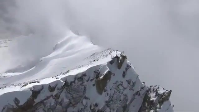 Man flies off a cliff, epic, blizzard, miyagi, world, winter, cliff, nature travel.