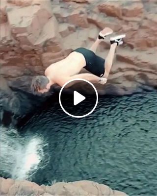 Cliff jumping off a beautiful waterfall