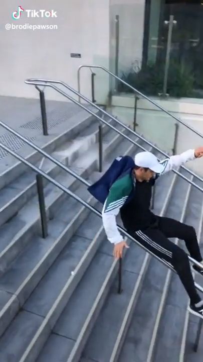 Guy slides down handrail. so amazing, funny, stairs, handrail.