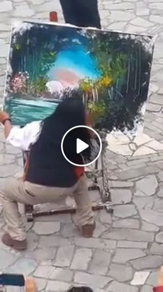 Street artist paints a fantastic picture with his hands