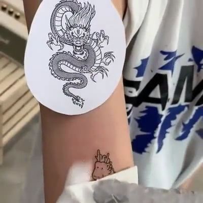 Something's wrong here, hihi, funny gifs, funny, dragon, tattoo.