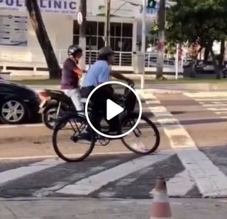 Cyclist Waiting At Traffic Lights Has Impressive Balance