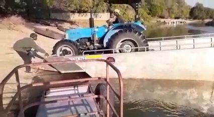 Funny tractor video, funny, tractor, river.