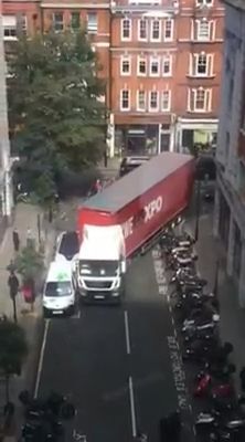 Driver heavy trucks through tight bend